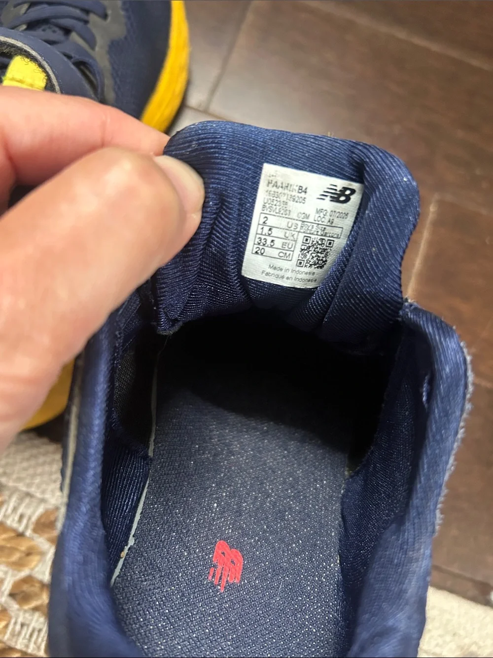 New Balance Kids Navy Sneakers with Yellow & Red Accents